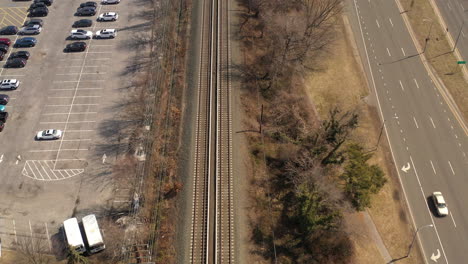A-top-down-shot-of-empty-train-tracks-on-a-sunny-day