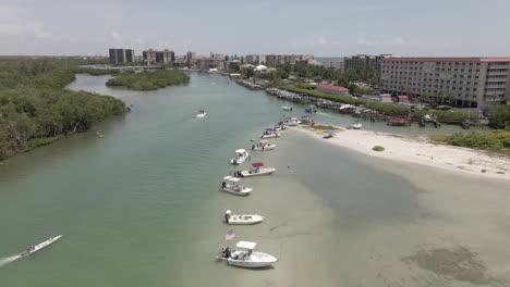Aerial-flyover:-Boats-line-Broadway-Channel-at-Bonita-Beach-in-Florida