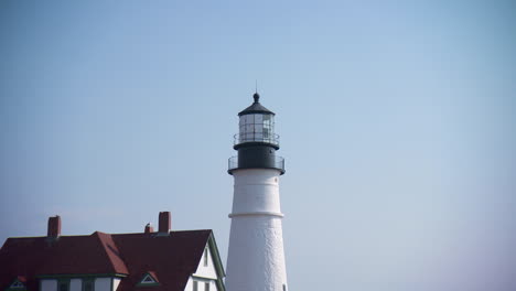 Iconic-Maine-lighthouse.-Zooms-out-to-reveal-flowers