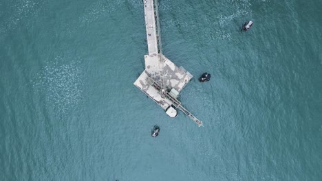 High-view-of-a-abandoned-construction-platform-located-out-in-the-ocean