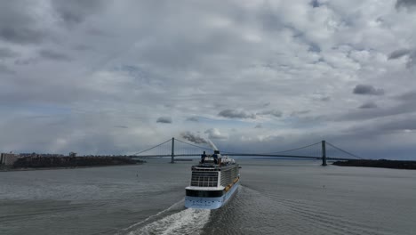 An-aerial-view-of-the-Royal-Caribbean-cruise-ship,-Anthem-of-The-Sea-leaving-NY,-in-Upper-Bay-heading-towards-the-Verrazano-Bridge-on-a-cloudy-day