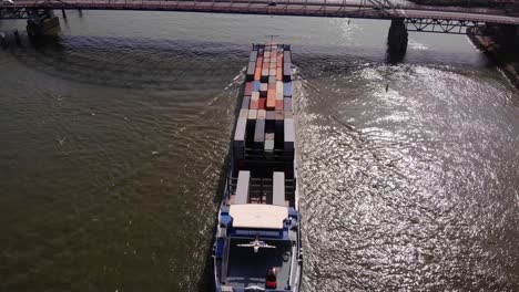 Aerial-Over-Missouri-Cargo-Container-Ship-Along-River-Noord-As-It-Passed-Underneath-Brug-Over-De-Noord
