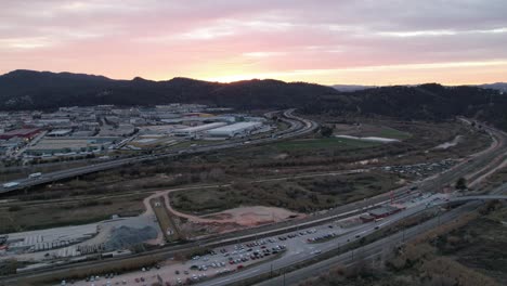 Aerial-Hyperlapse-View-Over-Castellbisbal-Train-Station-And-Motorway-During-Sunset