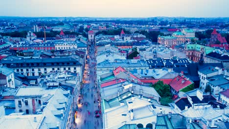 Poland-Krakow-rooftop-timelapse-at-subset-red-roof-tiles-street-lights-birds-eye-view-houses-from-top-old-buildings