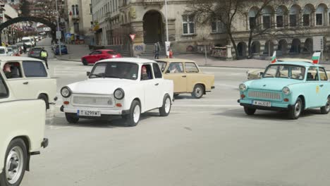 Convoy-of-Eastern-European-Trabant-retro-classic-cars-drive-through-city-streets