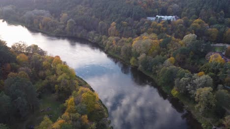 AERIAL-Orbiting-Shot-of-a-River-Bend-with-Autumn-Foliage-in-October