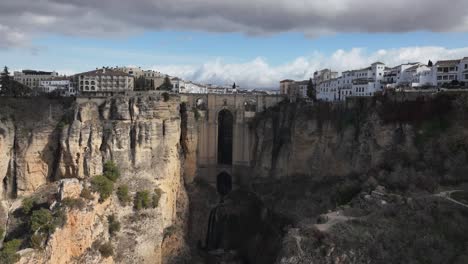 Aerial-hyperlapse:-Activity-at-famous-medieval-stone-bridge-in-Ronda