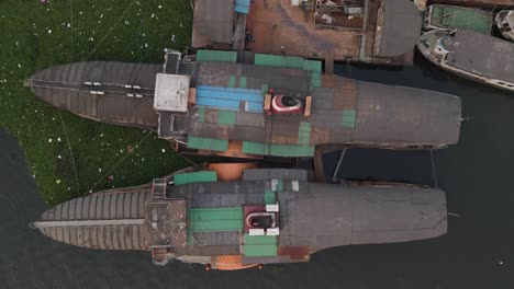 Aerial-drone-vertical-view-of-two-rocket-paddle-steamers-statics-in-the-waters-of-Dhaka,-Bangladesh