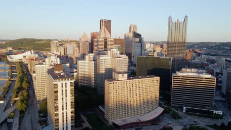 Aerial-view-around-highrise,-warm,-summer-evening-in-Pittsburgh-city,-USA---orbit,-drone-shot