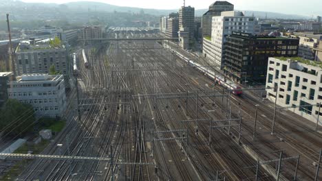 Fixed-Aerial-Shot-of-Train-Departing-Zurich's-Central-Station