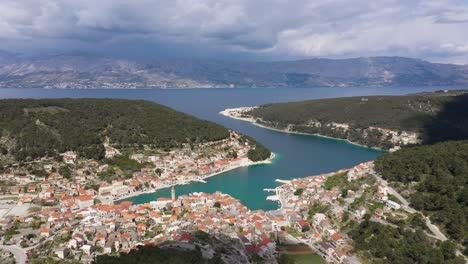 Panoramic-View-On-The-Scenic-Town-Of-Pucisca-On-Island-Brac,-Croatia---aerial-drone-shot