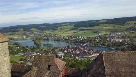Aerial-dolly-in-of-Hohenklingen-Castle-revealing-Stein-am-Rhein-picturesque-village-and-Rhine-river-in-green-valley,-Switzerland