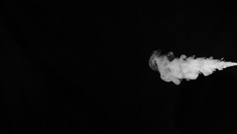 Slow-motion-stream-of-smoke-from-right-side-of-frame-that-moves-towards-the-center