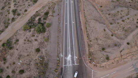 Aerial-pull-back-over-a-crossroads-in-the-desert