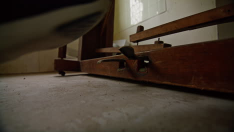 Medium-wide-shot-of-pressing-the-pedals-of-an-old-broken-piano