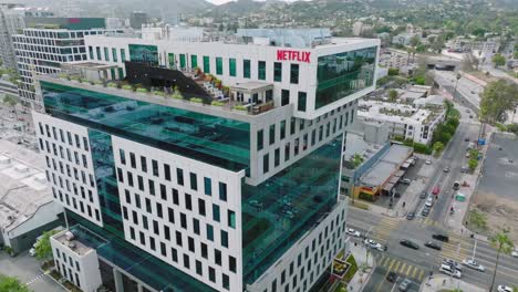 Drone-Shot-Circling-Netflix-Headquarters-in-Los-Angeles,-Shiny-Windows-and-Rooftop