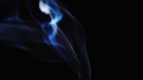 Abstract-blue-color-smoke-with-a-black-background-in-slow-motion