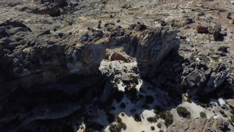 Birds-eye-drone-shot-of-Cederberg-near-Cape-Town---drone-is-flying-above-a-natural-rocky-arch
