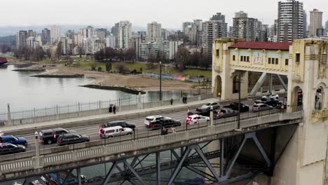 Freedom-Convoy---Vehicles-With-Canadian-Flags-Lined-Up-On-Burrard-Bridge-Over-False-Creek-In-Vancouver,-BC,-Canada
