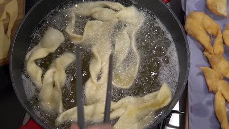 Deep-frying-Angel-Wings-Dough-In-A-Pan-With-Cooking-Oil