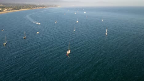 Aerial-View-Of-Sailboats-Sailing-In-The-Calm-Blue-Waters-At-Daytime