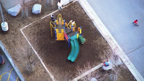 Aerial-view-of-children-at-a-playground-with-African-American-kids-playing-and-having-fun