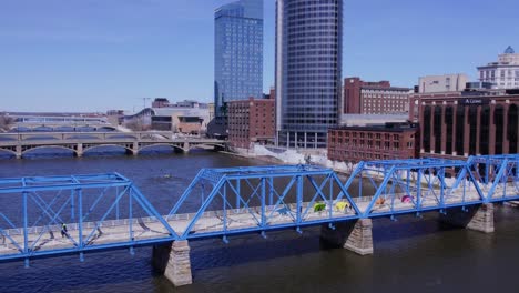 Blue-Bridge-and-Amway-Grand-Hotel-in-Grand-Rapids,-forward-aerial