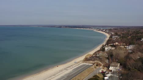 A-high-angle-aerial-view-over-Meschutt-Beach-on-Peconic-River,-Long-Island,-NY