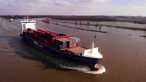 Aerial-View-Over-Forward-Bow-Of-WEC-de-Hoogh-Cargo-Ship-Along-Oude-Maas