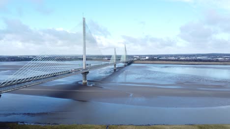 Mersey-gateway-landmark-aerial-view-above-toll-suspension-bridge-river-crossing-wide-angle-descending-shot