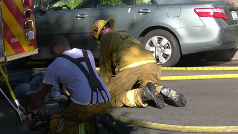 Firefighters-cleaning-turnout-gear-at-scene
