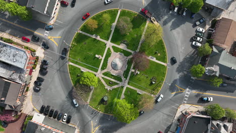 Top-down-aerial-of-traffic-circle-in-American-town
