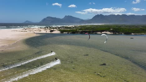 Extreme-kitesurfing-on-windy-day-near-South-Africa-coastline,-aerial-view