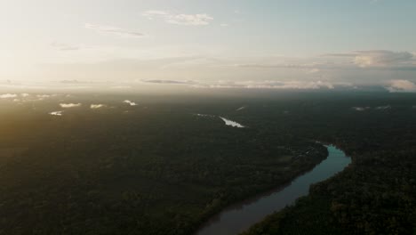 Vista-Of-Tropical-River-Amidst-Dense-Forestland-During-Sunrise-In-Ecuador