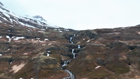 Stunning-Nature-Scenery-Klifbrekku-Waterfall-In-Mjoifjordur,-East-Iceland