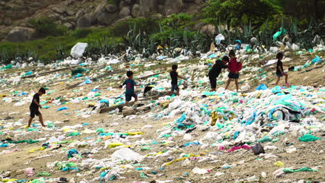 Children's-Walking-At-The-Beach-With-Garbage