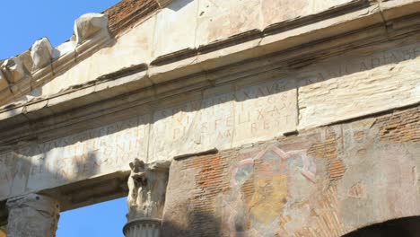 Low-angle-shot-of-colonnaded-Portico-of-Octavia-ancient-structure-in-the-Roman-Ghetto-next-to-Teatro-di-Marcello-in-Rome-Italy-at-daytime