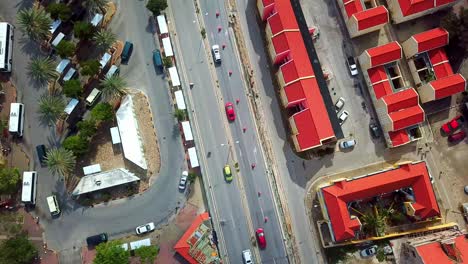 Overhead-view-of-cars-passing-through-the-streets-of-Willemstad,-Curacao,-Dutch-Caribbean-island