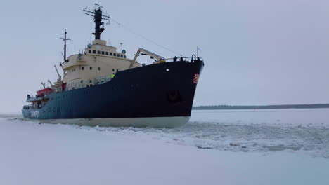 An-Icebreaker-Ship-Cruising-The-Frozen-Gulf-Of-Bothnia--Pullback-Shot