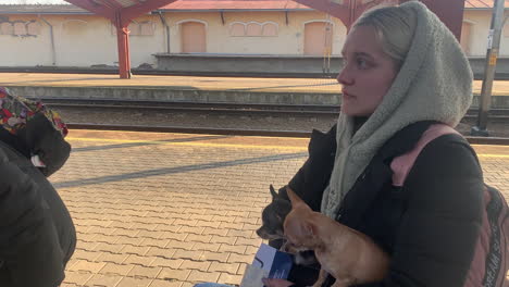 Ukrainian-refugee-at-the-train-station-in-Lviv-hoping-to-board-a-train-with-her-pet-dogs