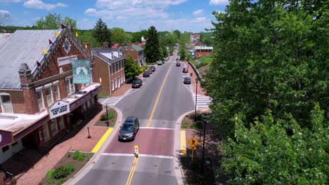 aerial-by-the-barter-theatre-low-pass-down-the-street-in-abingdon-virginia-in-4k