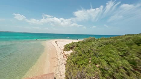 Aerial-drone-fpv-along-beautiful-and-pristine-coast-of-Isla-Cabra,-Montecristi-in-Dominican-Republic