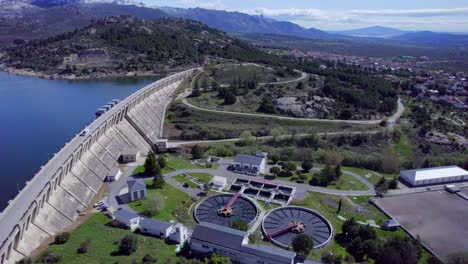 High-aerial-view-over-the-Navacerrada-Reservoir-and-dam-as-well-as-the-Sewage-treatment-plant
