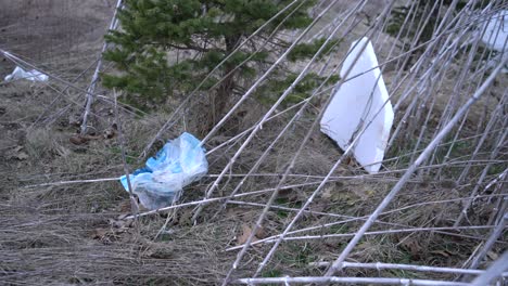 Plastic-bag-litter-laying-on-ground-polluting-Earth-and-nature