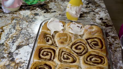 Icing-homemade-cinnamon-rolls-with-cream-cheese-frosting