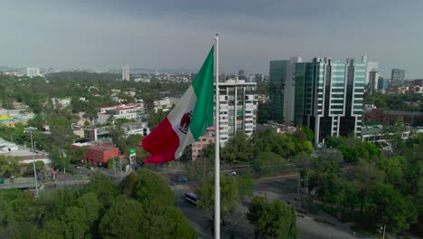 Orbital-footage-around-Mexico's-flag-in-middle-of-City