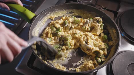 Cooking-And-Stirring-Eggs-And-Asparagus-In-A-Skillet
