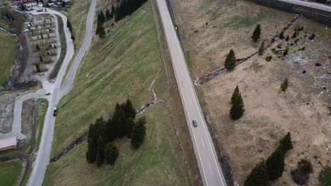 Car-going-on-the-mountain-road-in-Italy-drone-aerial-view