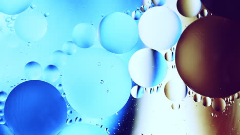 Real-abstract-colourful-oil-drops-in-water-rotation-with-color-gradient-mixing-background
