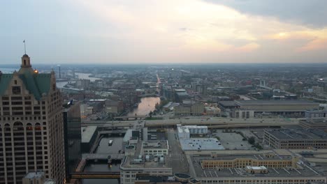 Aerial-view-of-Milwaukee-river-and-the-cityscape,-moody-sunset-in-Wisconsin,-USA